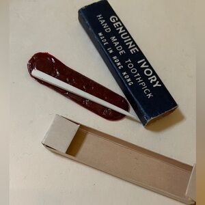 Antique Vintage Ivory toothpick in protective sleeve and box.